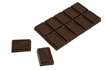 Tasty dark chocolate on a white background