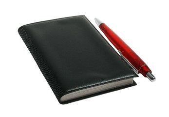 Black notebook and pen