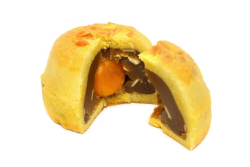 A sliced Shanghai moon cake with yolk in the center.