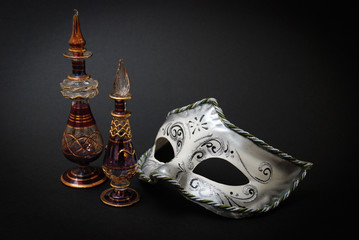 Two Venetian Glass jugs and a Venetian mask on black background
