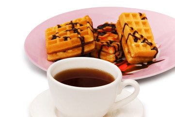 Tea and belgian waffles isolated on the white