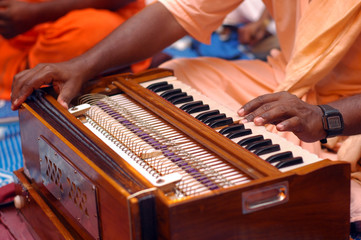 Krishna Devotee Playing Harmonium