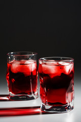 Two beautiful glasses with a cocktail and an ice