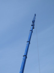 Obraz premium blue construction crane