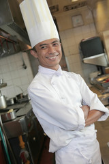 chef standing at kitchen restaurant