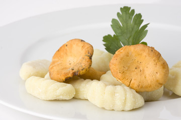 uncooked gnocchi noodles on a plate