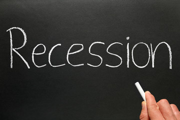 Recession written in chalk on a blackboard.