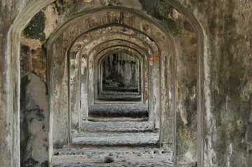 Fototapeta na wymiar Remains of an old ruined corridor