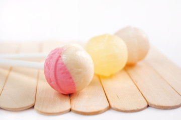 Lollipops on the wooden background