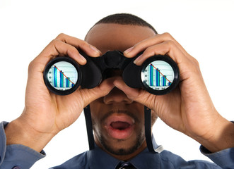 business person looking into binoculars to bankruptcy