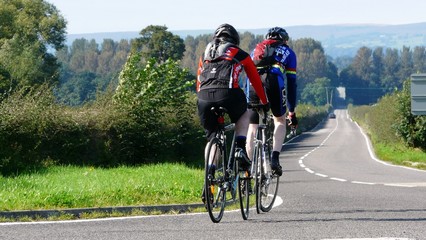 Cyclists on long country road
