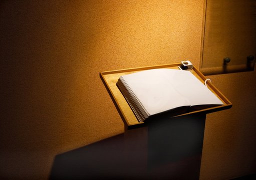 Open blank page of a book in a dim room
