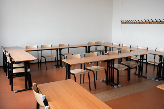 Empty Classroom With Chairs And Tables