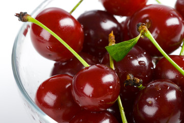 heap sweet cherry in a transparent bowl