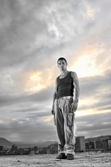 young man dancing and jumping  on top of the building
