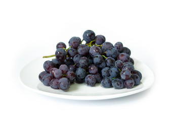 Ripe black grapes isolated on white background