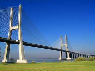 Bridge with green grass and blue sky