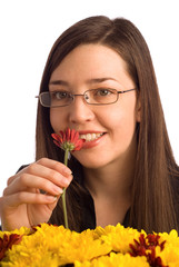 Woman smelling valentine or gift flowers isolated on white
