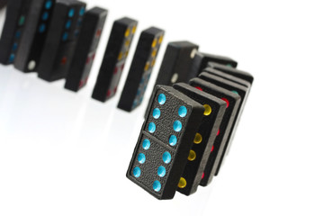 Vintage colored dominoes, in a row ready to fall.