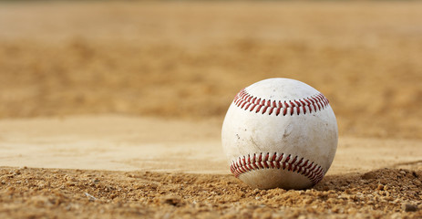 one baseball on home plate at a sports field - 9529595