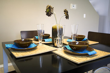 Closeup on a setup dinner table in a kitchen