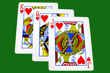 King,Queen and Jack of hearts iolated on green
