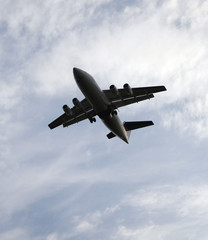 Flight of the plane in the dark blue sky