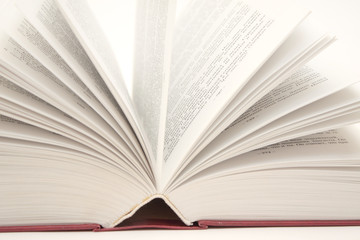 Opened book - object over white