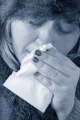 under the weather or feeling blue, sick woman with a flu