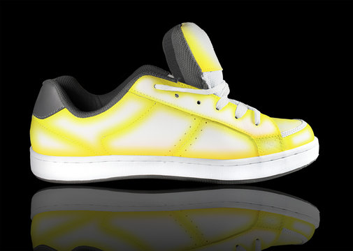 yellow-white sneaker on a black background