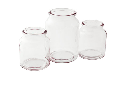 Empty glass jars on white background