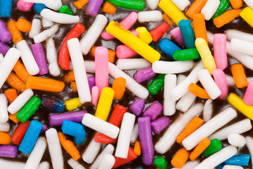 Sprinkles candy on top of Donut for background close up shot