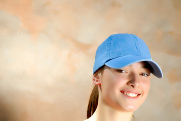 portrait young, beautiful, girls in  blue cap