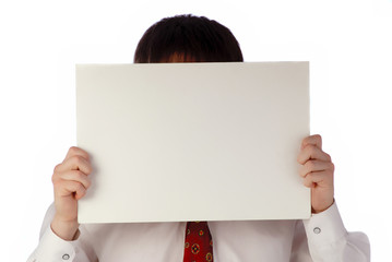 businessman holds in hands  white sheet of  paper