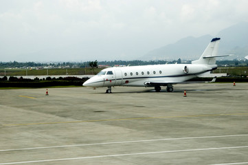Small jet plane parked at Lijiang airport in Yunnan province