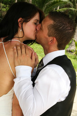 Happy bride and groom kissing on their wedding day.