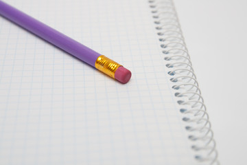 opened notebook with pencil