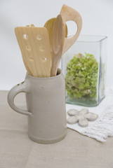 wooden kitchen utensils in a jug