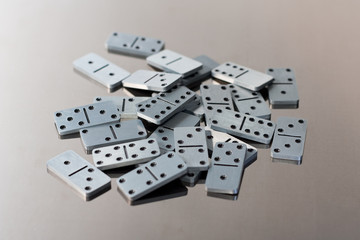 Steel dominoes on a polished surface