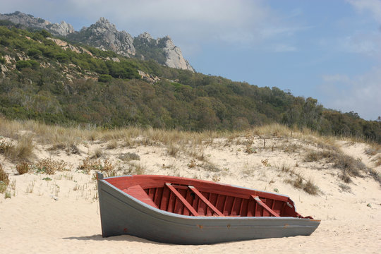 A stranded boat on a deserted beach in Cadiz, South of Spain