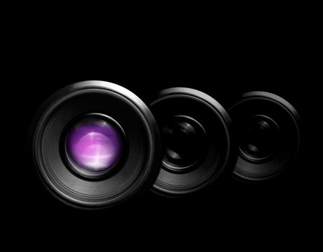 camera lenses on blackbackground. front view