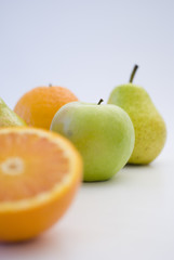 orange, apple and pear fresh fruit isolated on white