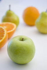 orange, apple and pear fresh fruit isolated on white