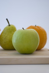 orange, apple and pear fresh fruit isolated on white