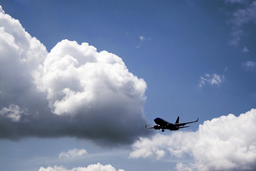 A silhouette of a commercial passenger plane.