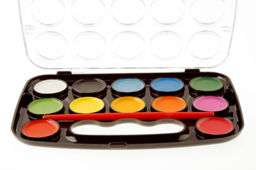 Close-up of a watercolor palette set isolated on white