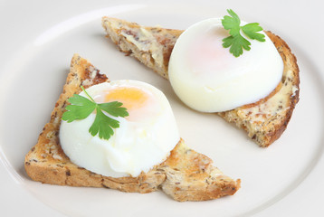 Two poached eggs on buttered toast