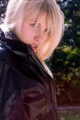 Naklejka premium blond woman in nature, outside portrait