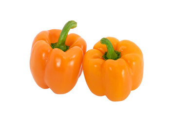 Two orange peppers isolated on white