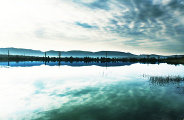 Sunrise scene on mountains lake